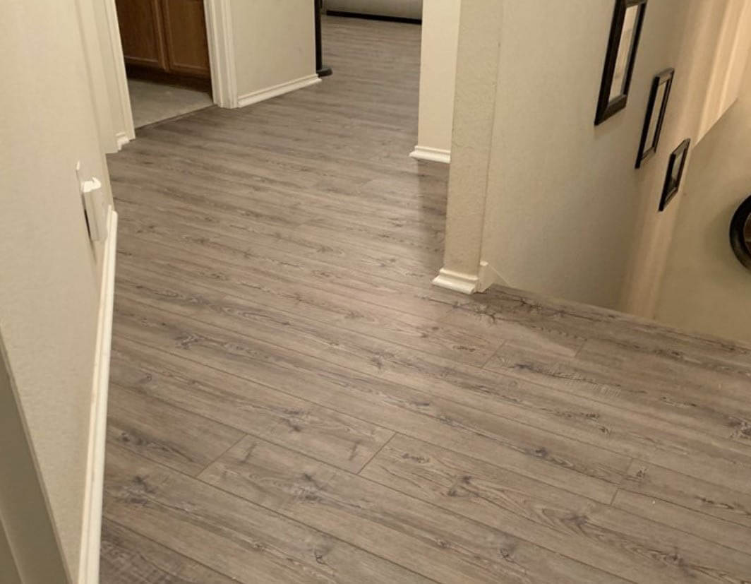 gray laminate floor installed by Austin Hardwood Flooring